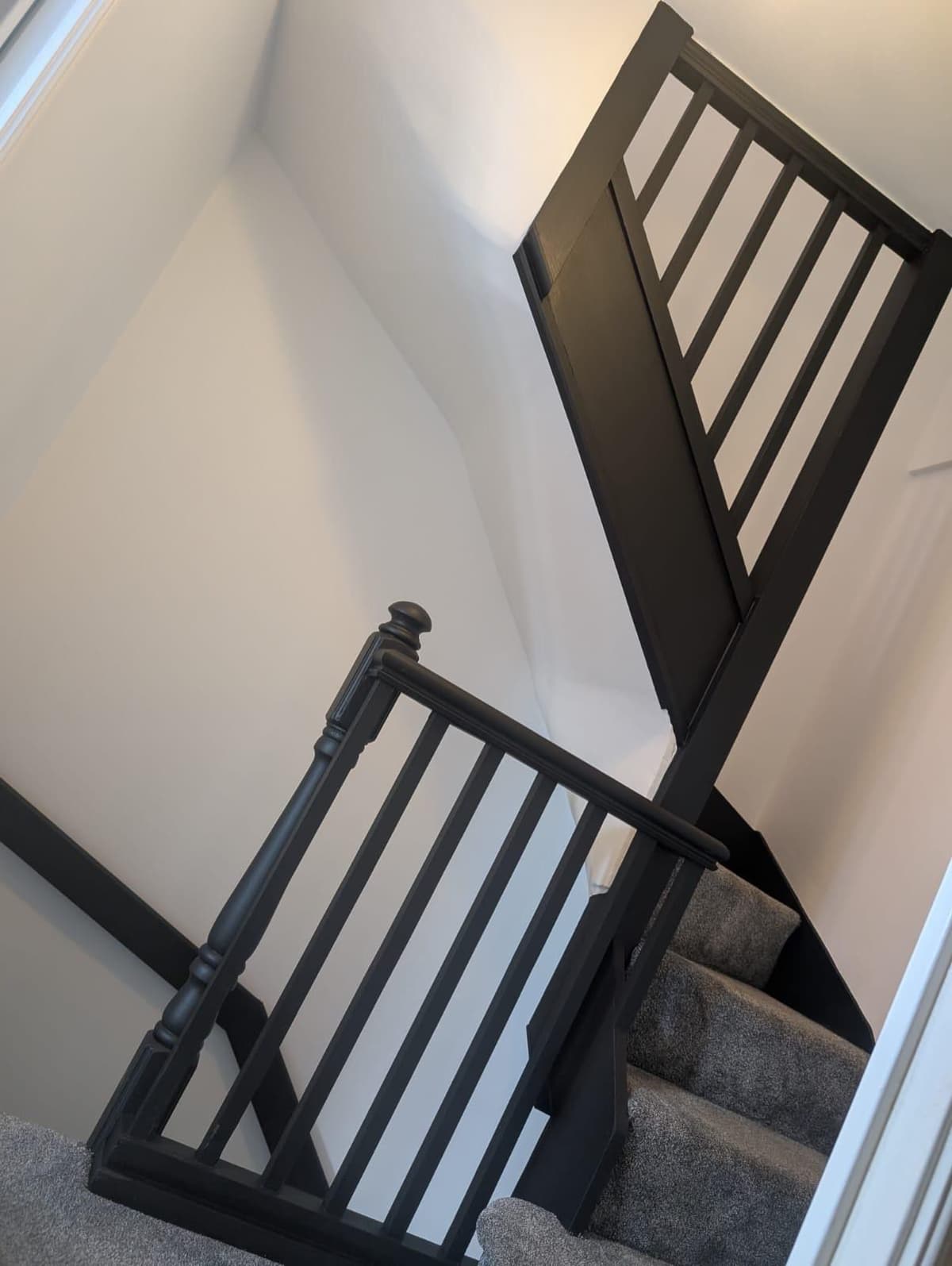 Dark painted staircase banister and railings