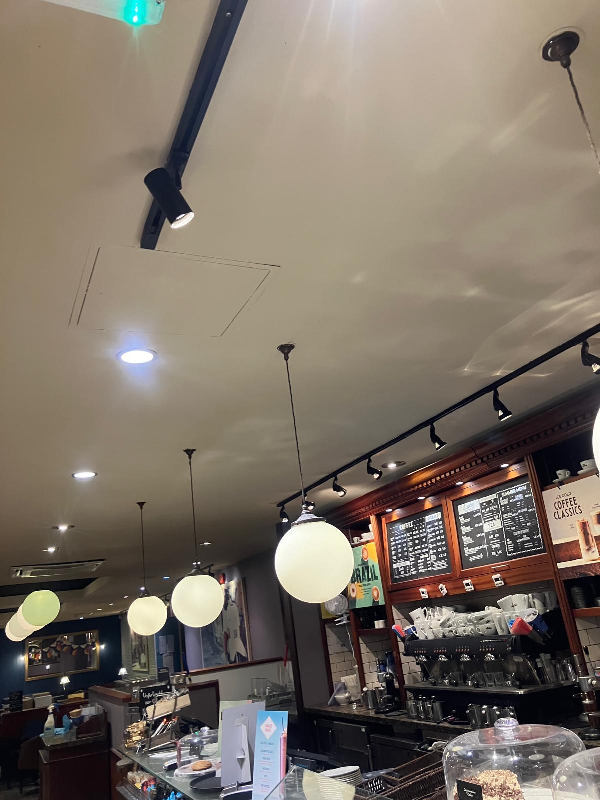 Freshly painted ceiling in commercial cafe