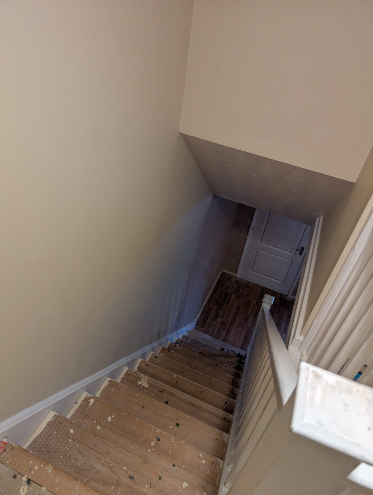 Freshly painted stairwell and hallway in neutral tones