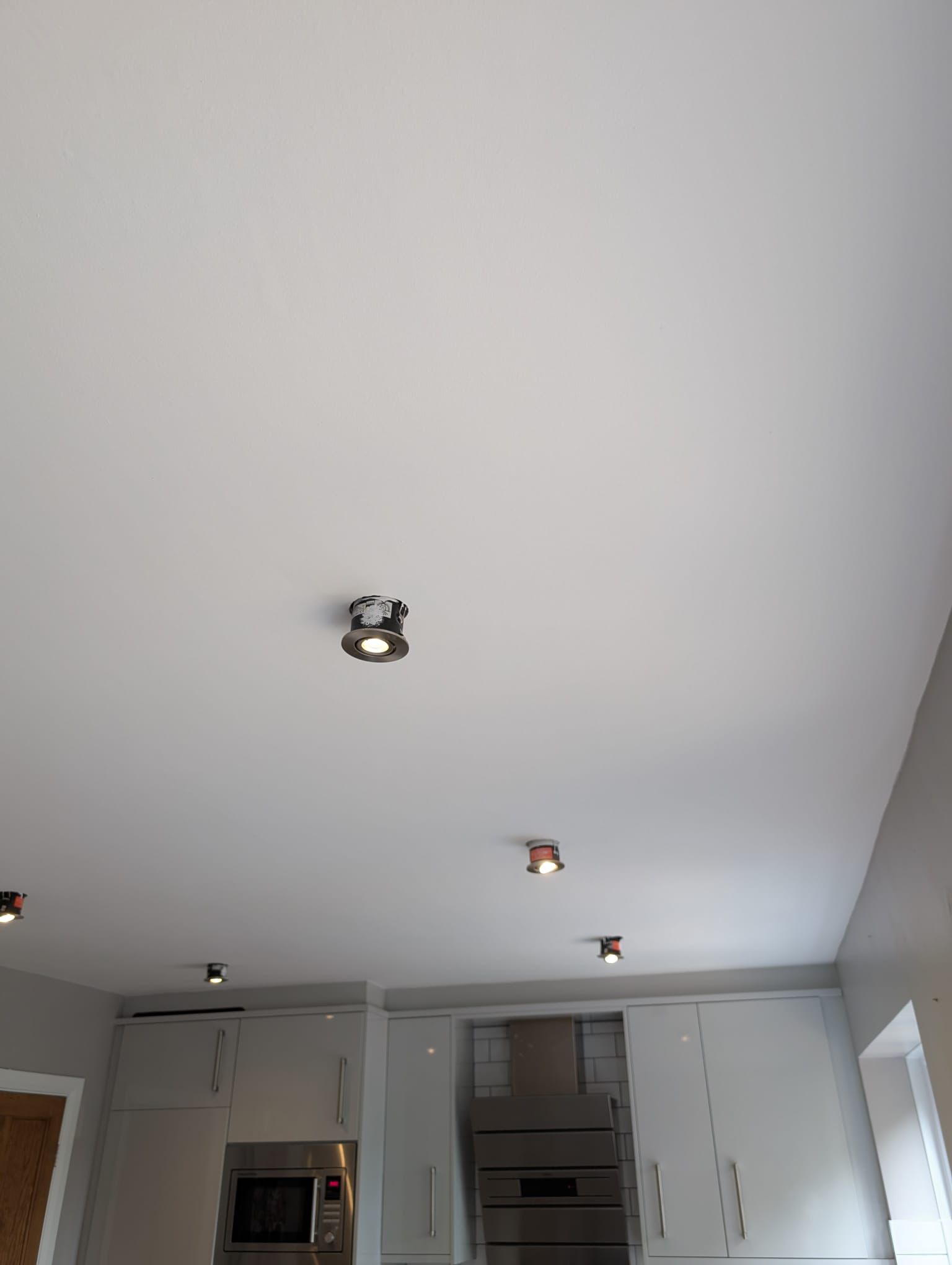 Freshly painted white kitchen ceiling