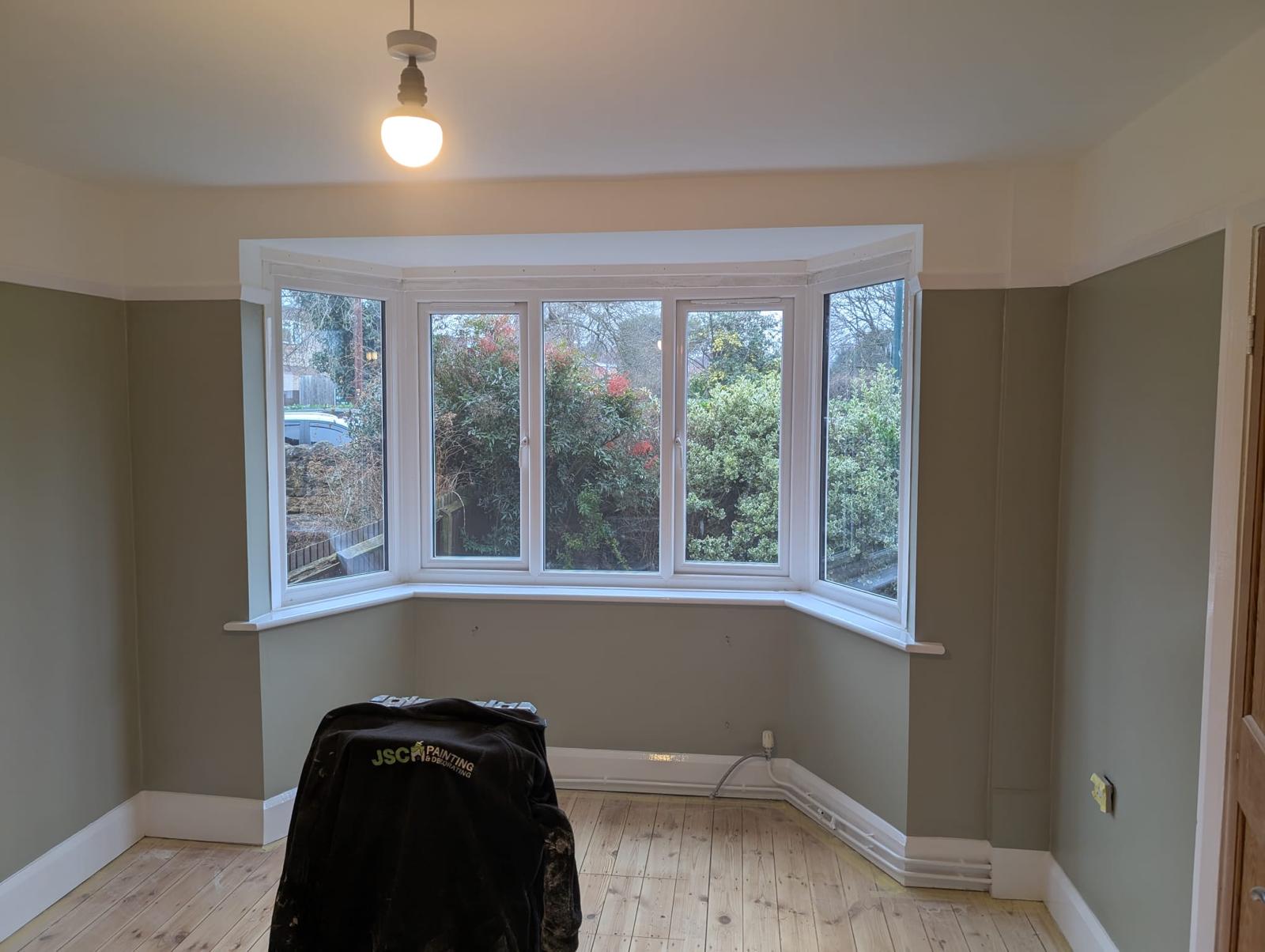 Living room with freshly painted walls and bay window