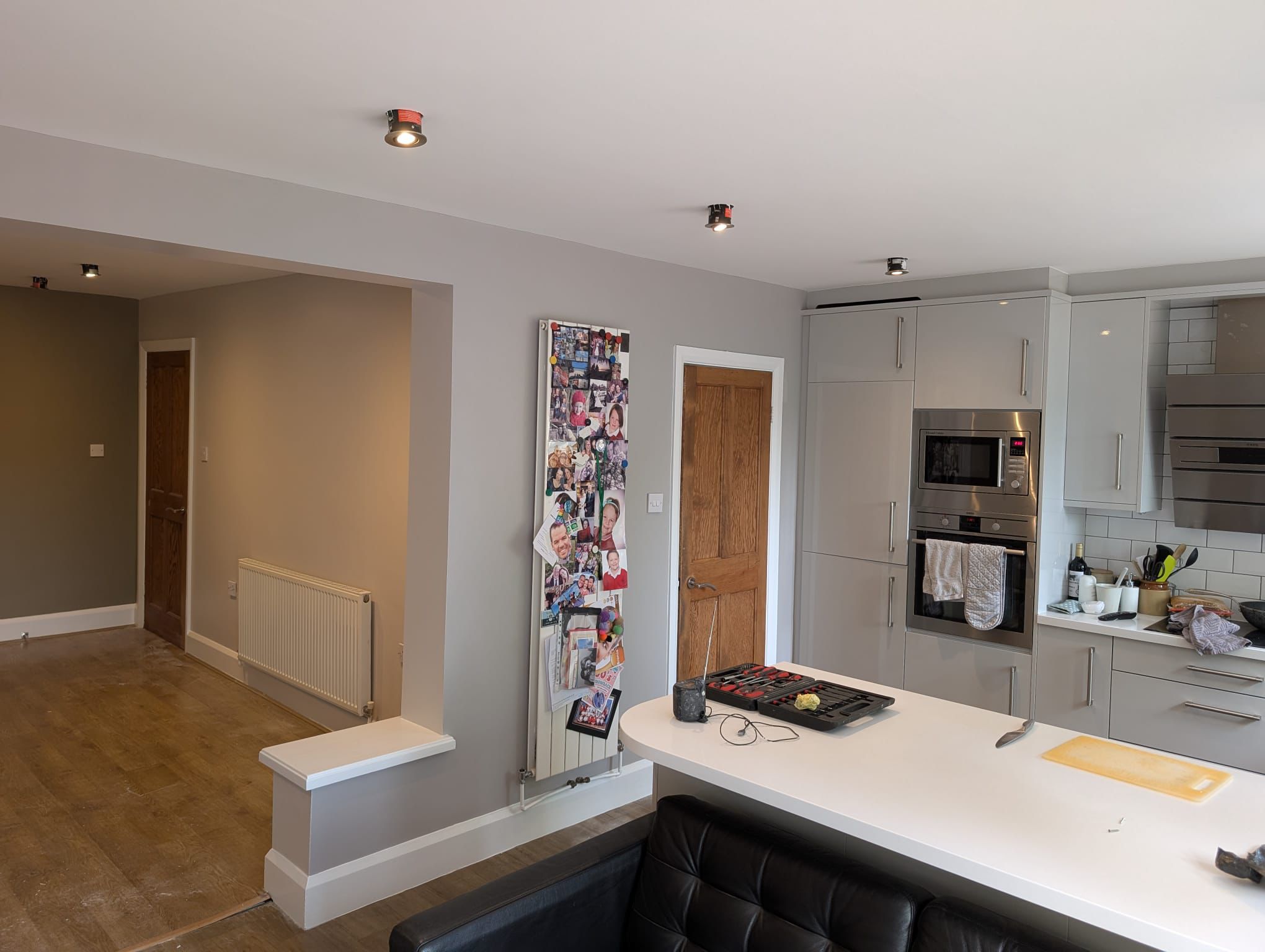Open-plan kitchen and living area with freshly painted walls