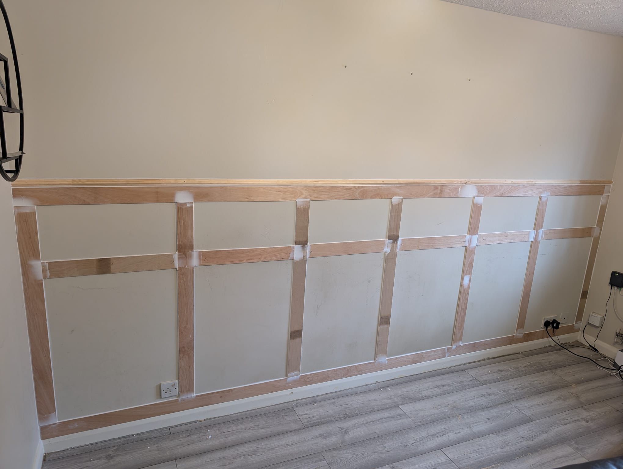 Wainscoting battens being fitted to wall
