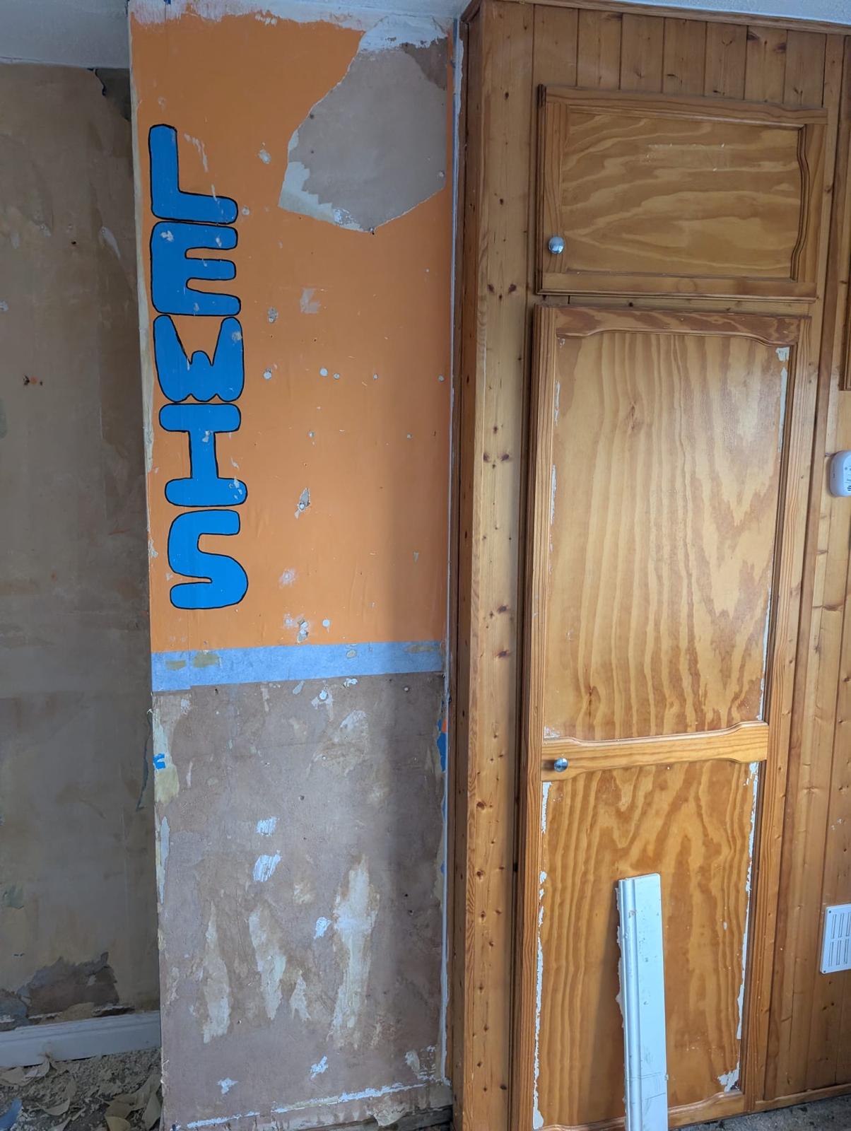 Room with old paint and wallpaper needing full prep